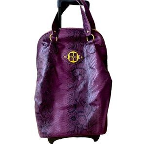 vintage IMAN travel bag with rollers